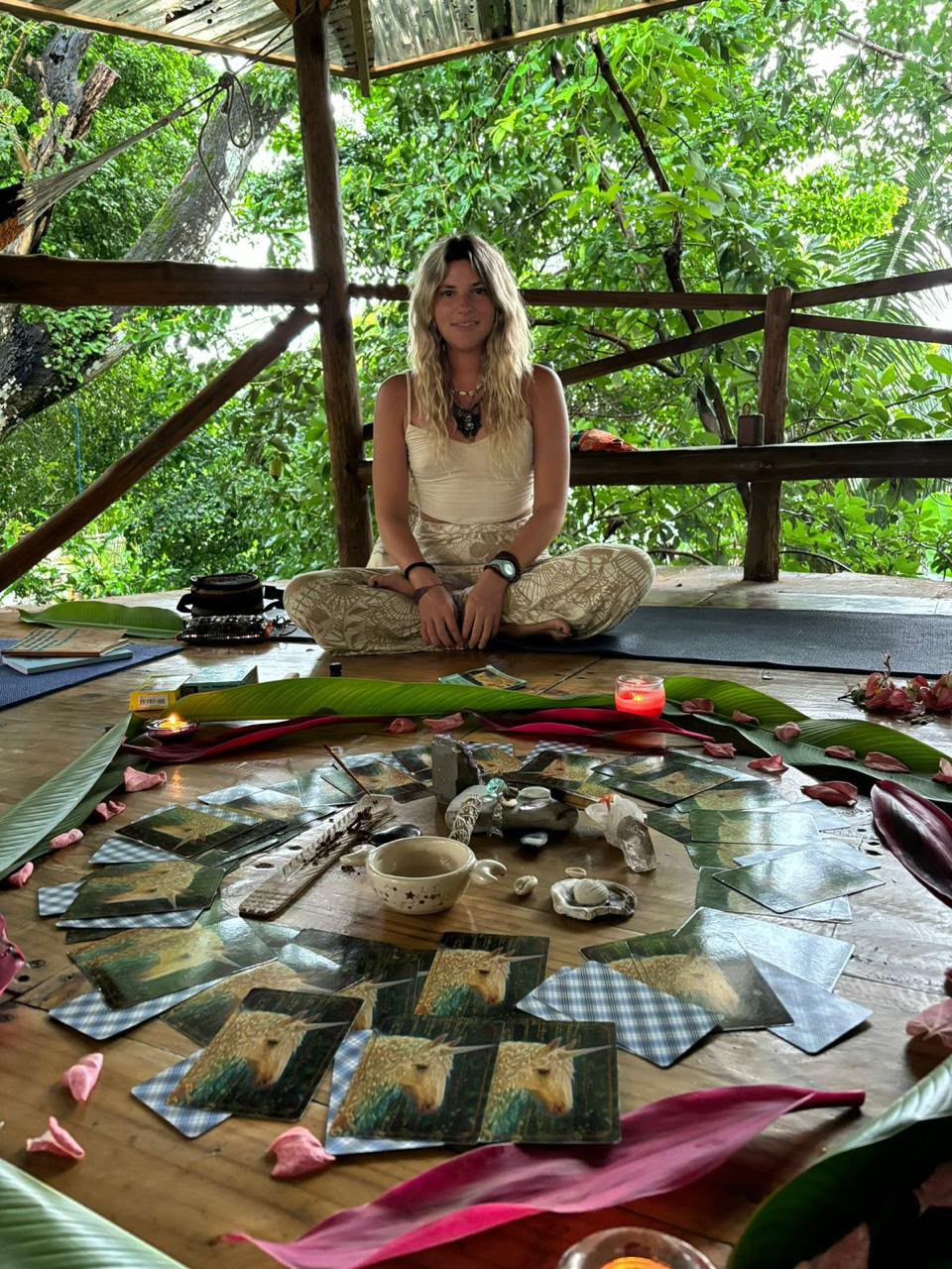 Juli Kessler with oracle card mandala in ceremonial space